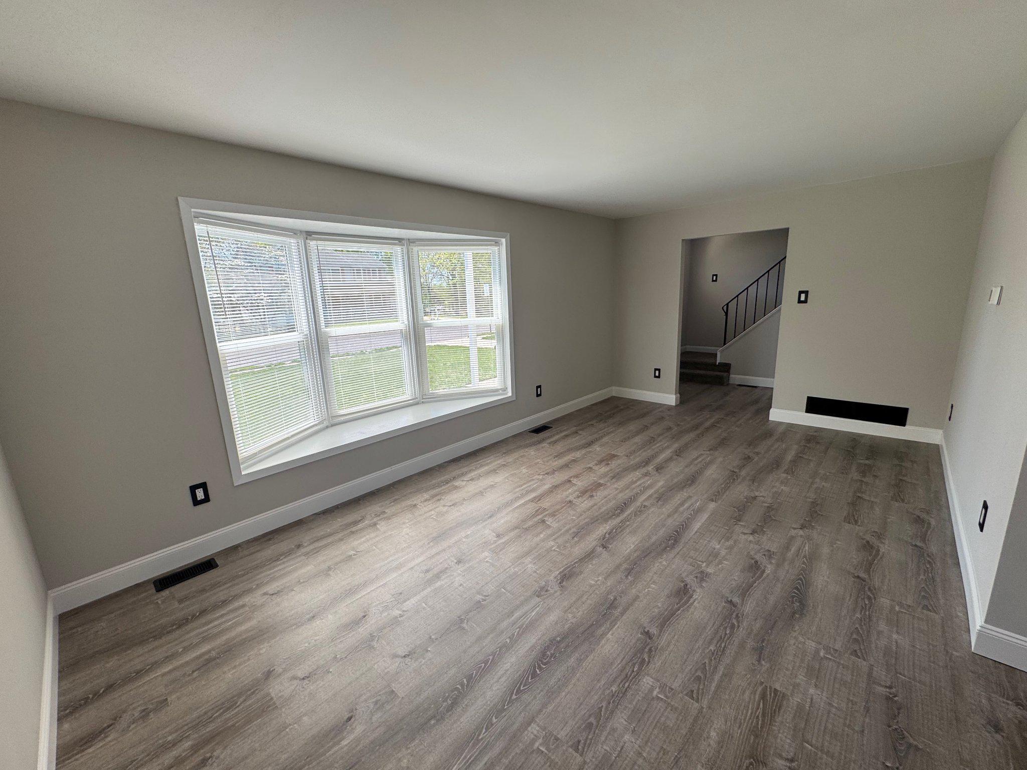 8 Framingham Road Beverly, NJ 08010 - Photo 13 of 35 a view of an empty room with a window and wooden floor