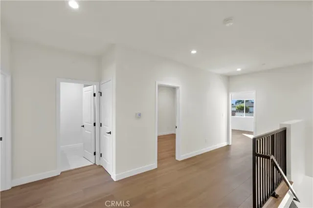 a view of a livingroom with wooden floor and entryway