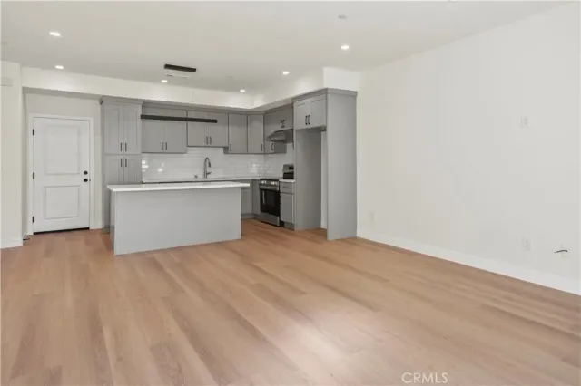 a view of kitchen with wooden floor