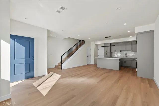 a view of a kitchen with sink and cabinet