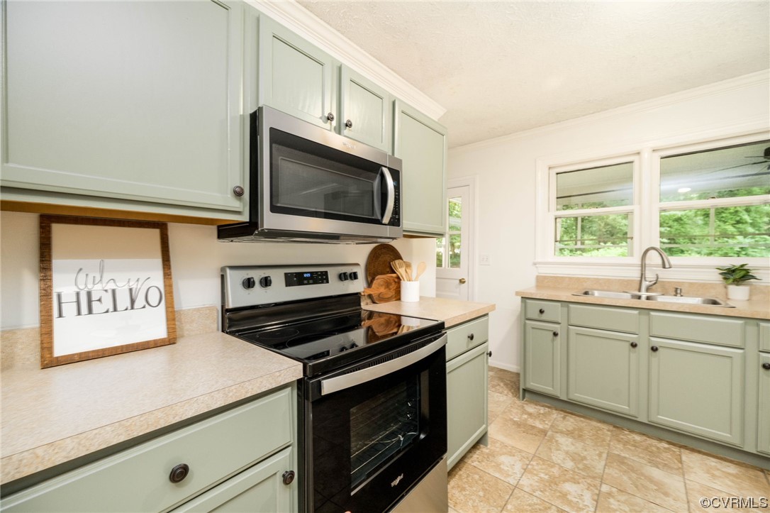 11824 Boyd Road Chester, VA 23831 - Photo 14 of 36 a kitchen with stainless steel appliances a stove sink and microwave