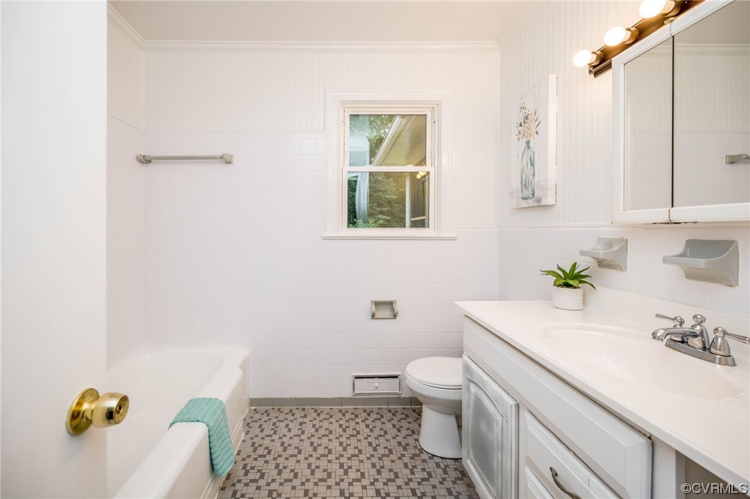 11824 Boyd Road Chester, VA 23831 - Photo 18 of 36 a bathroom with a sink toilet and mirror