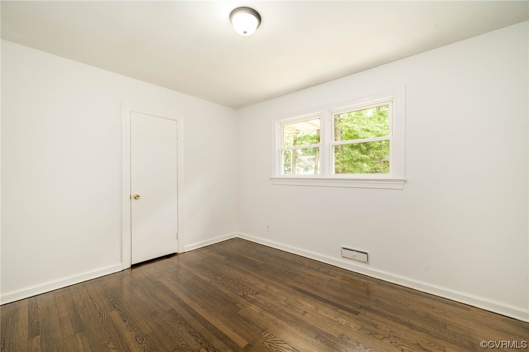 11824 Boyd Road Chester, VA 23831 - Photo 20 of 36 an empty room with wooden floor and windows