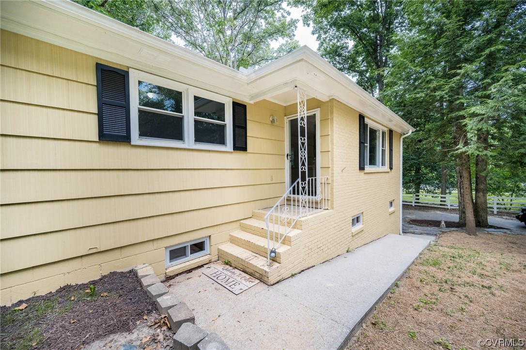 11824 Boyd Road Chester, VA 23831 - Photo 2 of 36 a view of a house with a backyard