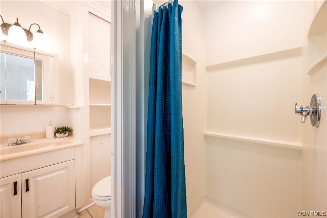 11824 Boyd Road Chester, VA 23831 - Photo 23 of 36 a bathroom with a sink a toilet and shower