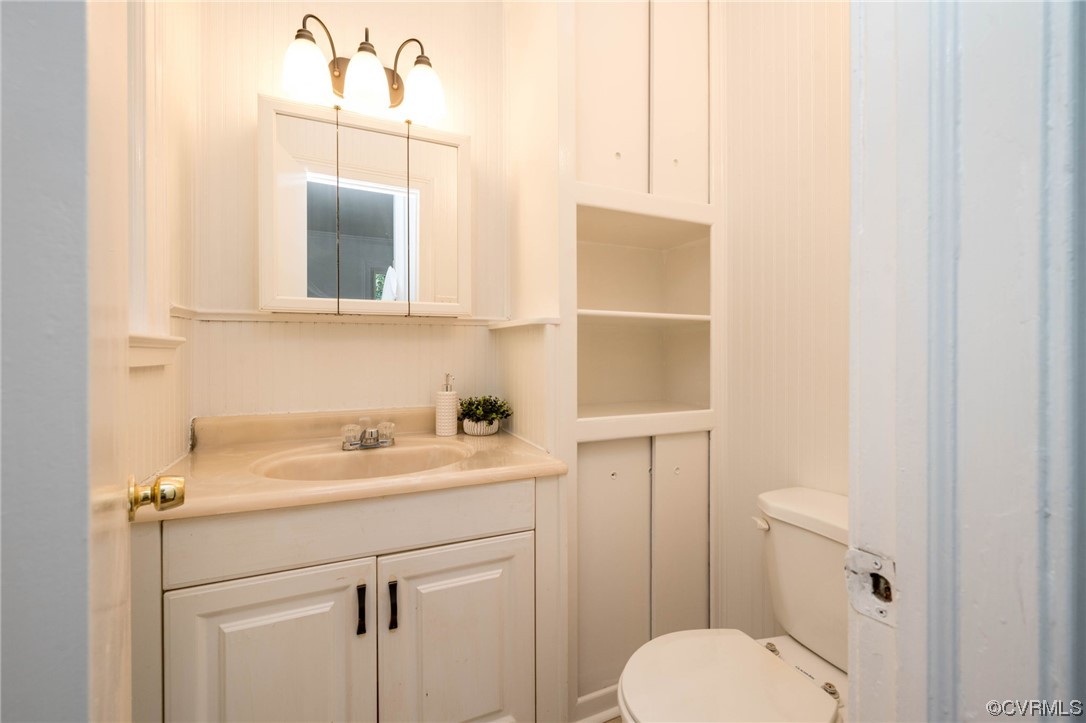 11824 Boyd Road Chester, VA 23831 - Photo 24 of 36 a bathroom with a sink toilet and mirror