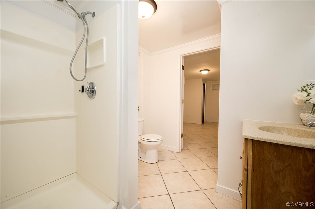 11824 Boyd Road Chester, VA 23831 - Photo 30 of 36 a bathroom with a granite countertop shower and a sink