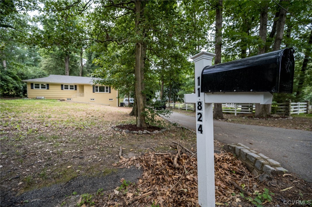 11824 Boyd Road Chester, VA 23831 - Photo 3 of 36 a backyard of a house with barbeque oven table and chairs
