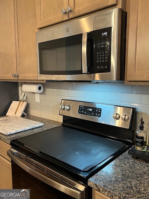832 Ambient Way Atlanta, GA 30331 - Photo 12 of 32 a kitchen with a stove and a microwave