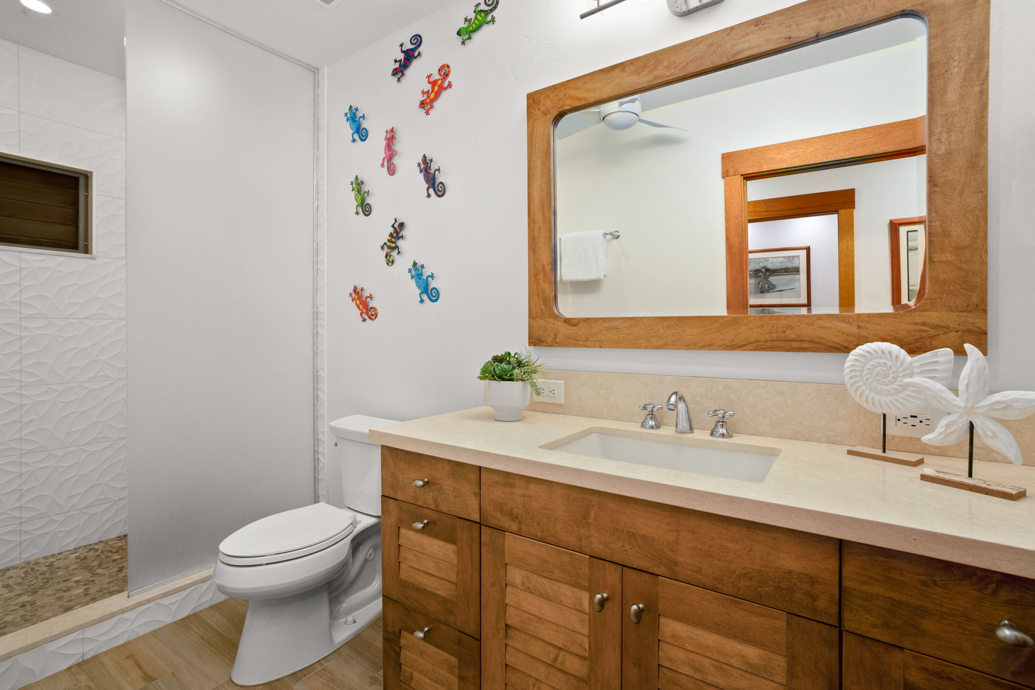 2253 Poipu Road, Unit 163 Koloa, HI 96756 - Photo 3 of 3 a bathroom with a toilet a sink and mirror