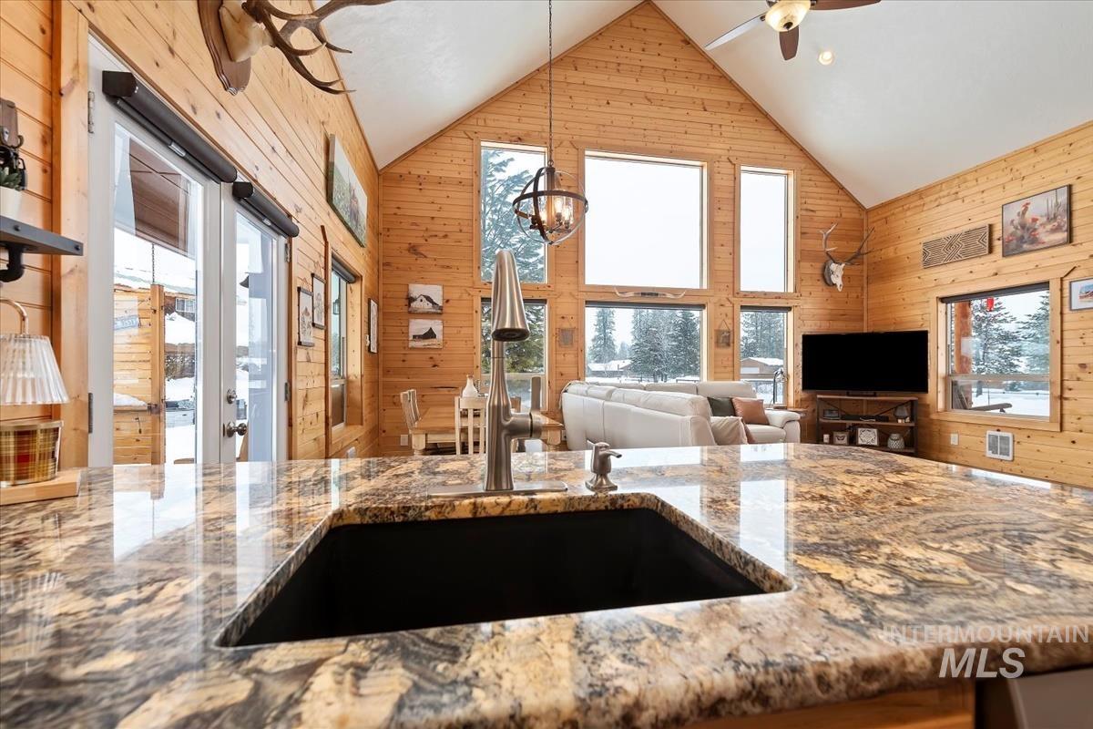 3 Boone Road Garden Valley, ID 83622 - Photo 30 of 49 Spacious interior with wood-finish flooring, white walls, multiple windows, recessed lighting, and an angled ceiling