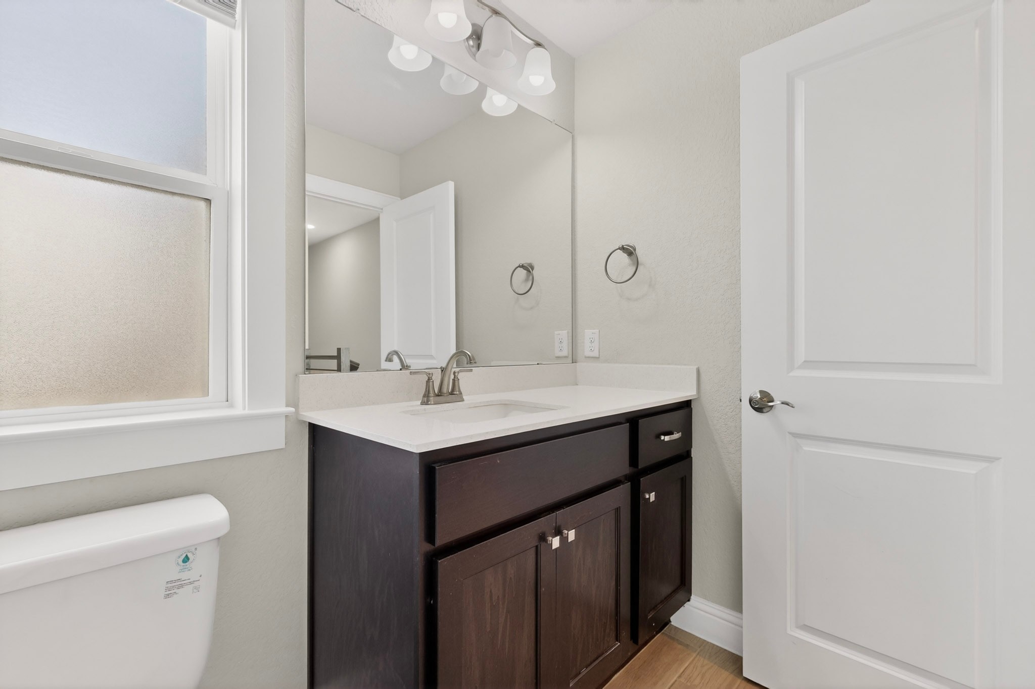 2605 Sam Bass Road, Unit 9 Round Rock, TX 78681 - Photo 19 of 38 A well-appointed bathroom vanity with ample counter space and a large mirror.