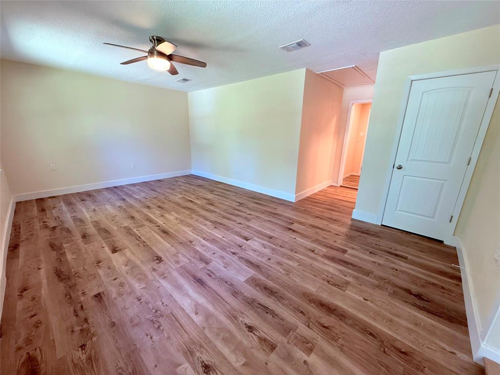 45 County Road 1197 Yantis, TX 75497 - Photo 11 of 26 a view of empty room with wooden floor