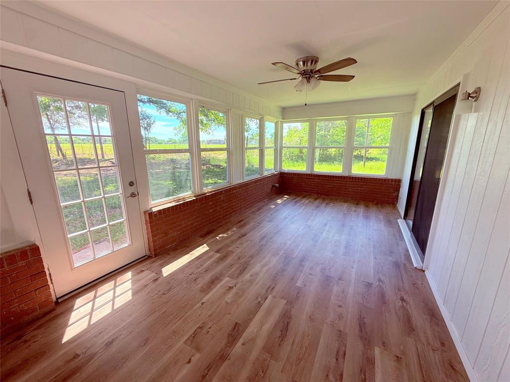 45 County Road 1197 Yantis, TX 75497 - Photo 14 of 26 a view of empty room with wooden floor and fan