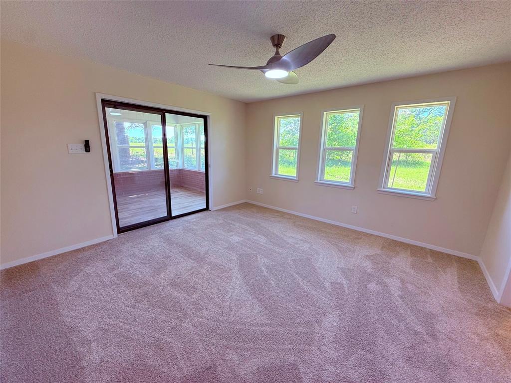 45 County Road 1197 Yantis, TX 75497 - Photo 15 of 26 an empty room with windows and closet