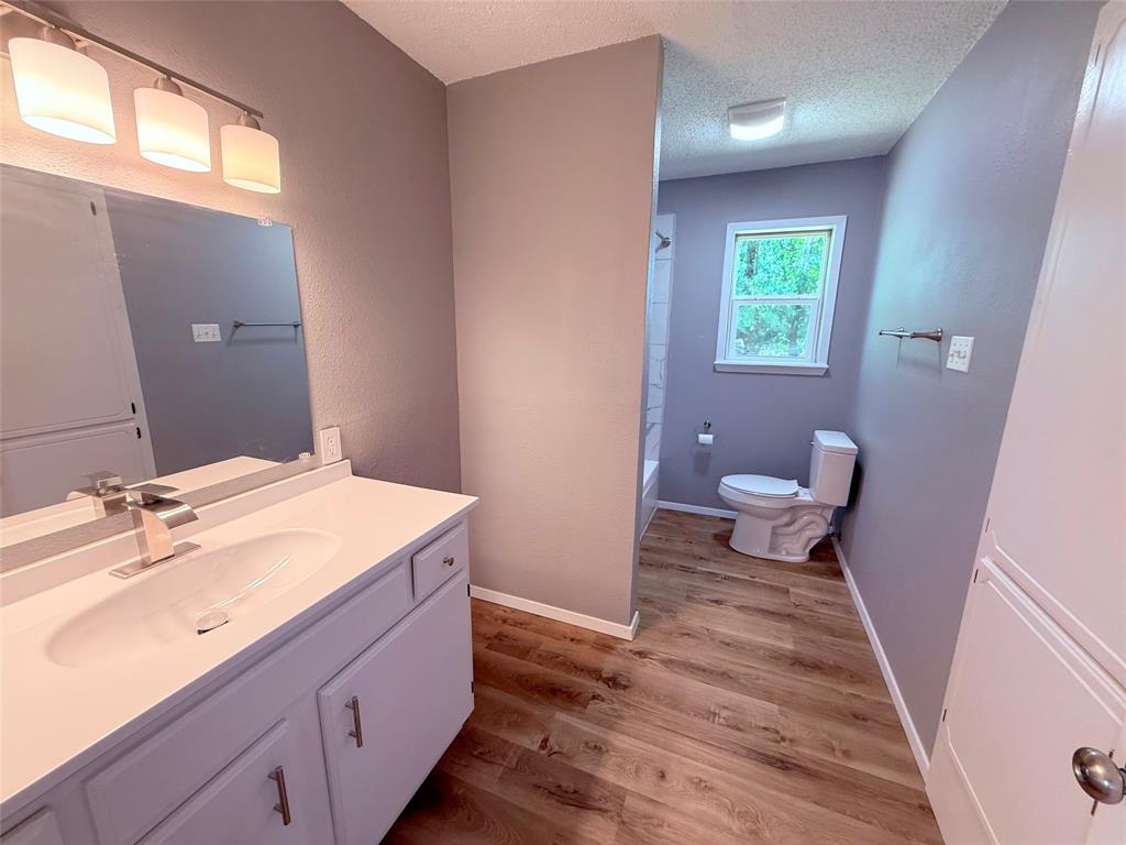 45 County Road 1197 Yantis, TX 75497 - Photo 17 of 26 a bathroom with a sink and a mirror