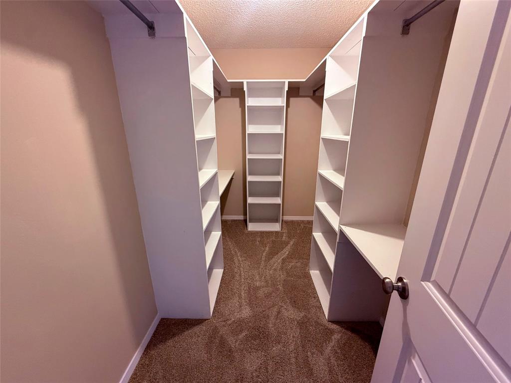 45 County Road 1197 Yantis, TX 75497 - Photo 19 of 26 a view of walk in closet with empty racks