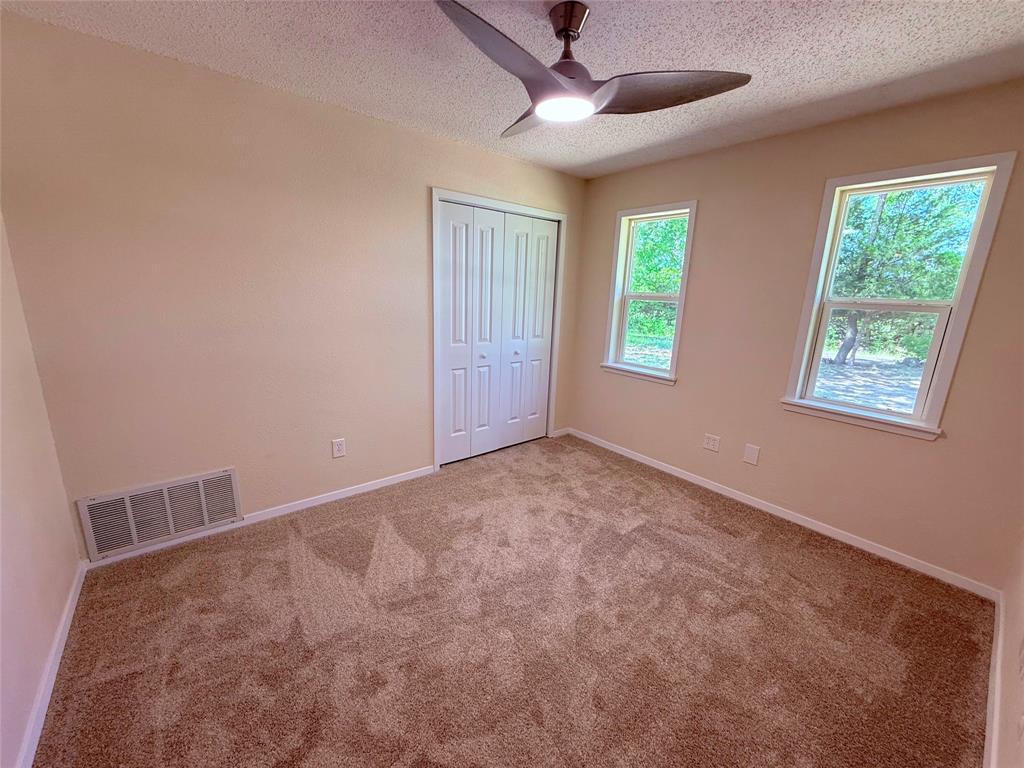 45 County Road 1197 Yantis, TX 75497 - Photo 20 of 26 a view of an empty room with windows