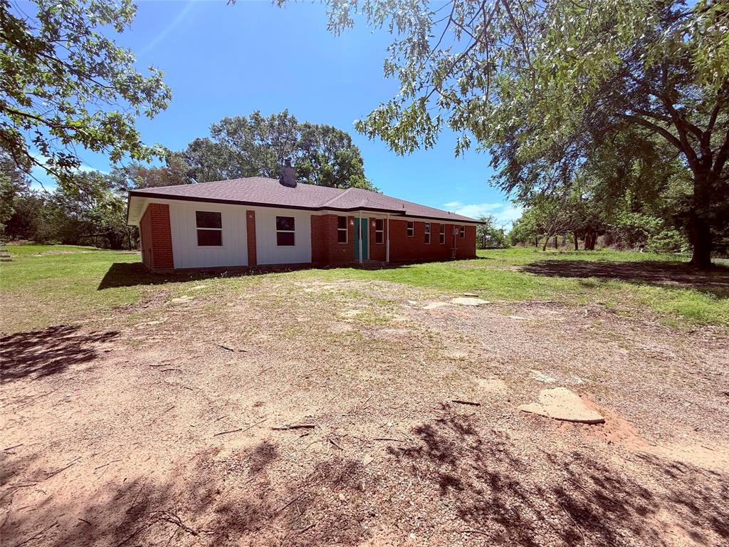 45 County Road 1197 Yantis, TX 75497 - Photo 3 of 26 a front view of house with yard and trees