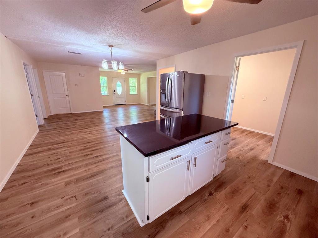 45 County Road 1197 Yantis, TX 75497 - Photo 8 of 26 a kitchen with sink and cabinets