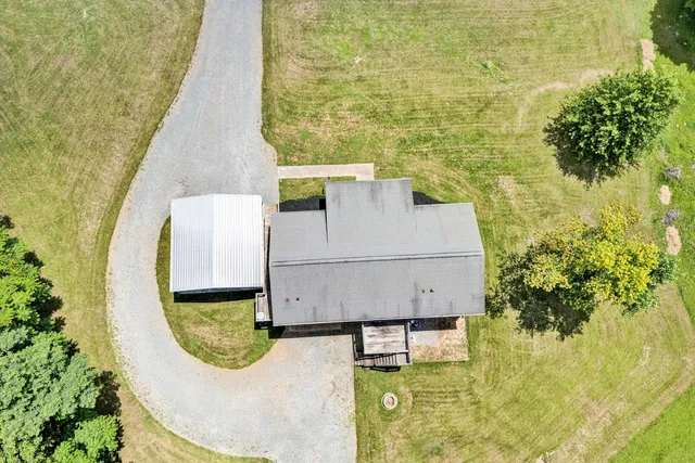 an aerial view of a house having yard