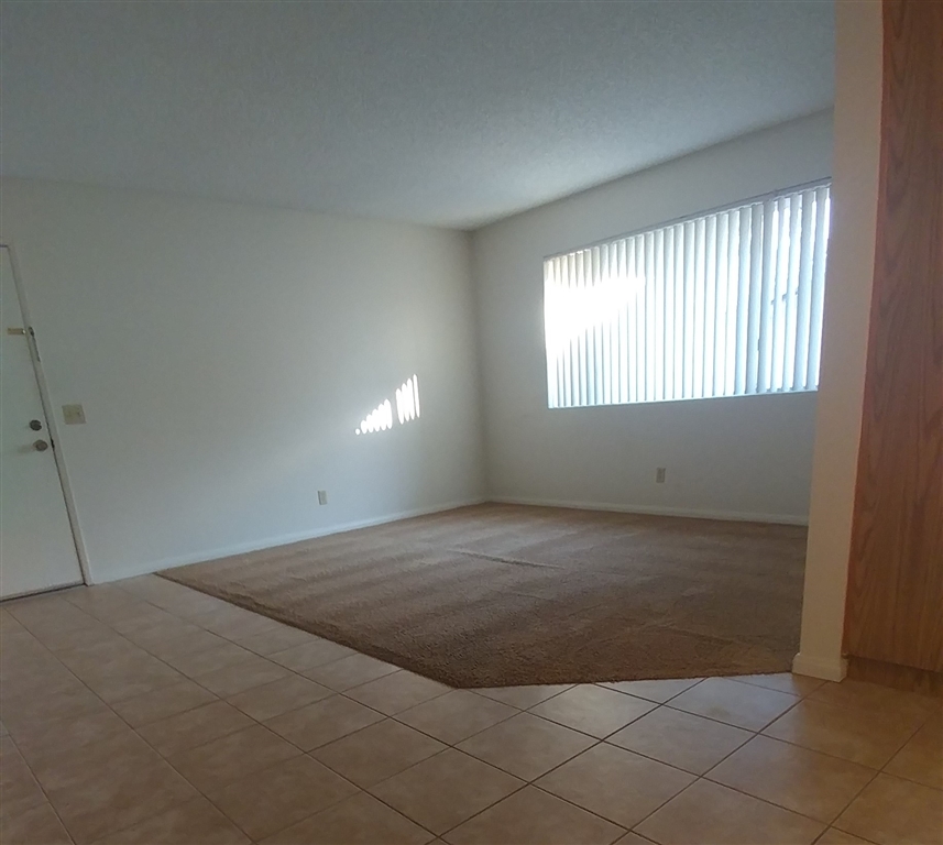 10386 Alphonse Street, Unit G4 Santee, CA 92071 - Photo 3 of 9 Large window in living room adds lots of light.