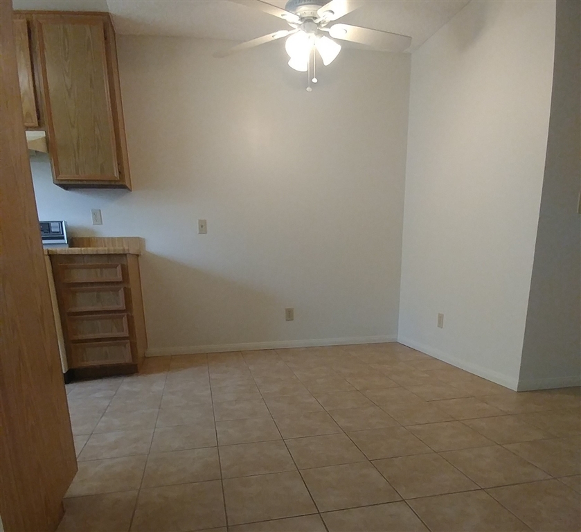 10386 Alphonse Street, Unit G4 Santee, CA 92071 - Photo 5 of 9 Tiled ding area with ceiling fan.
