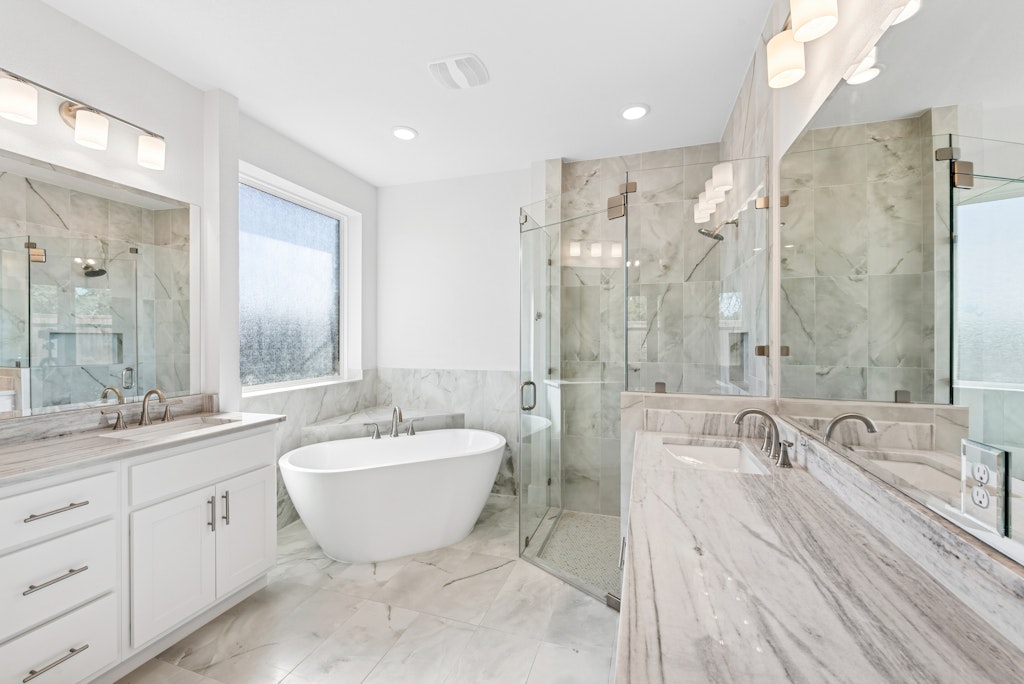 3332 Emerald Lake Path Georgetown, TX 78628 - Photo 19 of 35 a spacious bathroom with a double vanity sink mirror and bathtub