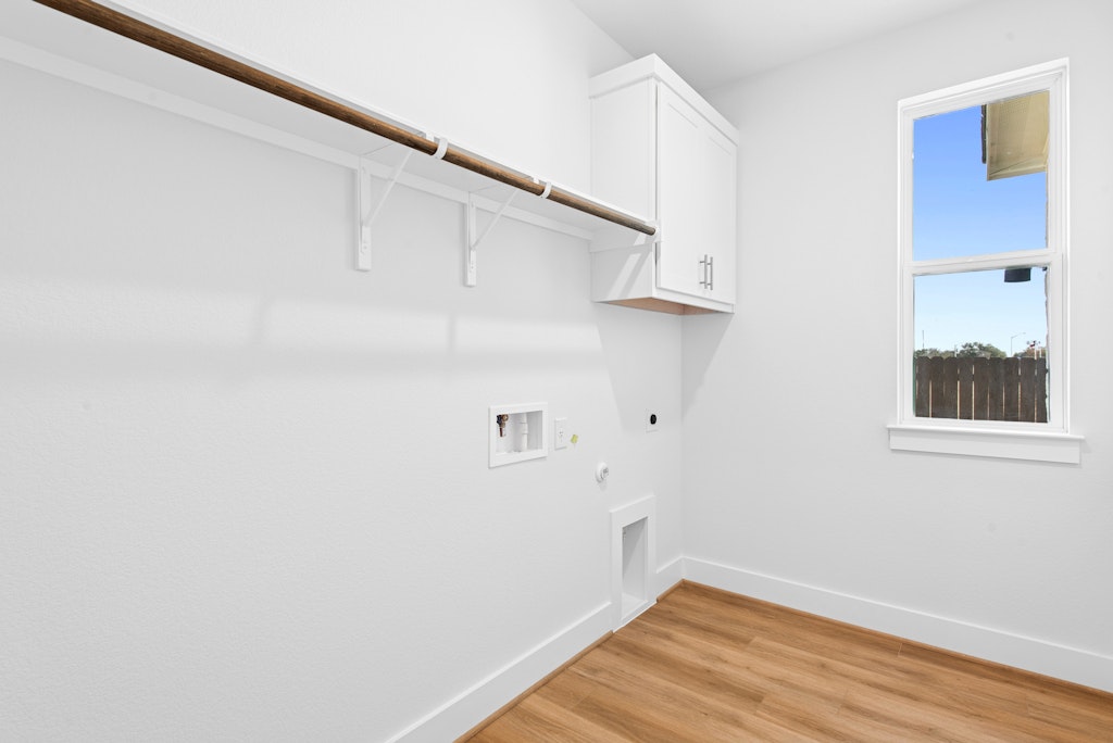 3332 Emerald Lake Path Georgetown, TX 78628 - Photo 23 of 35 a view of a room with wooden floor and cabinet