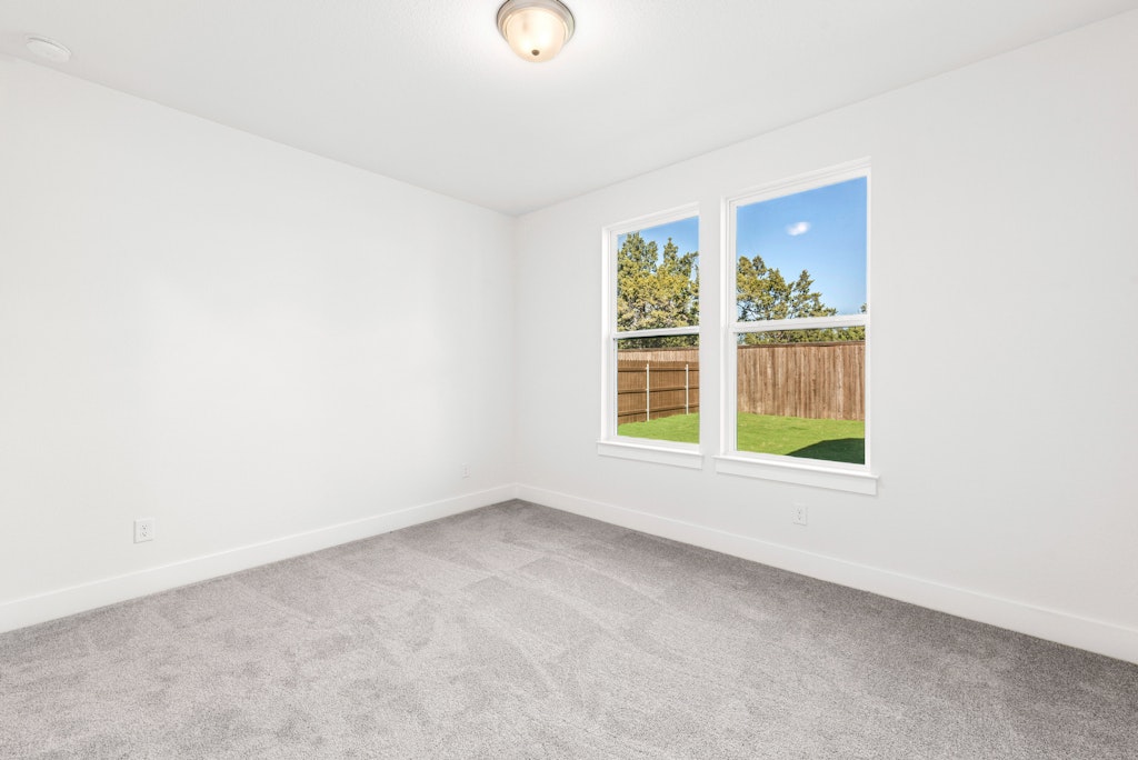 3332 Emerald Lake Path Georgetown, TX 78628 - Photo 27 of 35 an empty room with windows