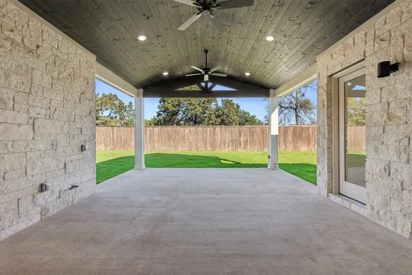 a view of a porch with a backyard