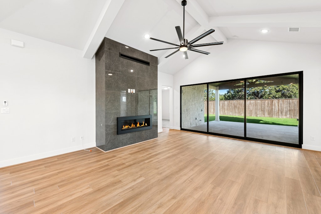 3332 Emerald Lake Path Georgetown, TX 78628 - Photo 6 of 35 a view of room with wooden floor fan and windows