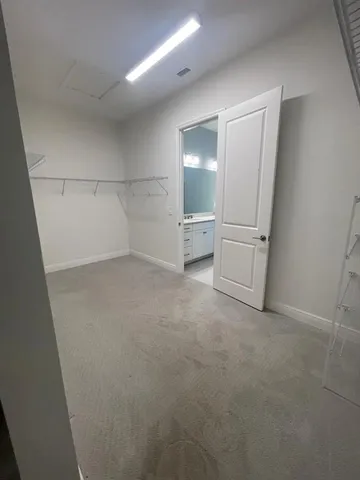a bathroom with a double vanity sink and mirror