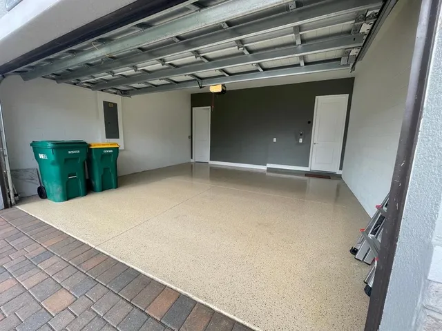 a front view of a house with a yard and a garage
