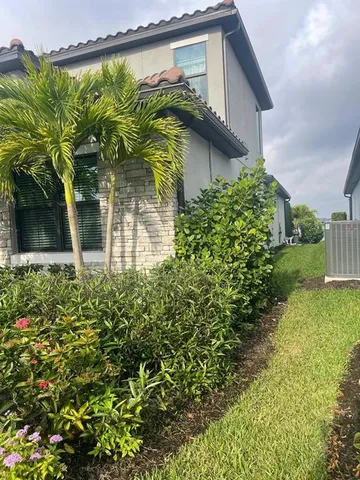 a backyard of a house with lots of green space