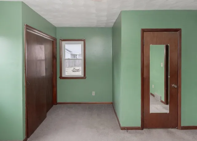 a view of an empty room and window