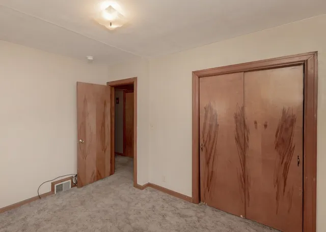 an empty room with closet