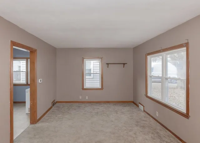 an empty room with windows