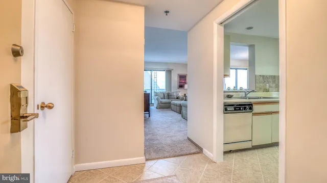 a view of a kitchen from the hallway
