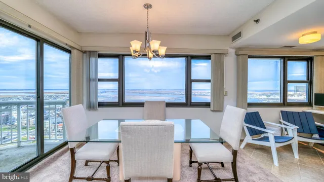 a view of a dining room with furniture window and outside view