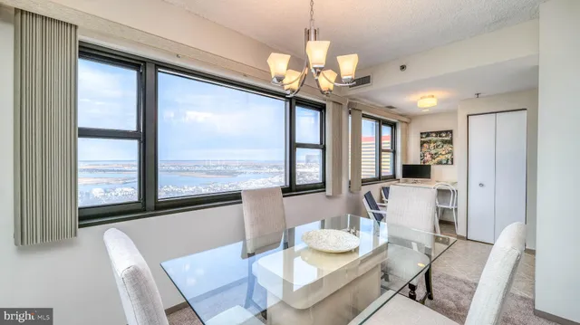 a view of a dining room with furniture window and outside view
