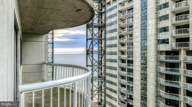a view of a balcony with a floor to ceiling window