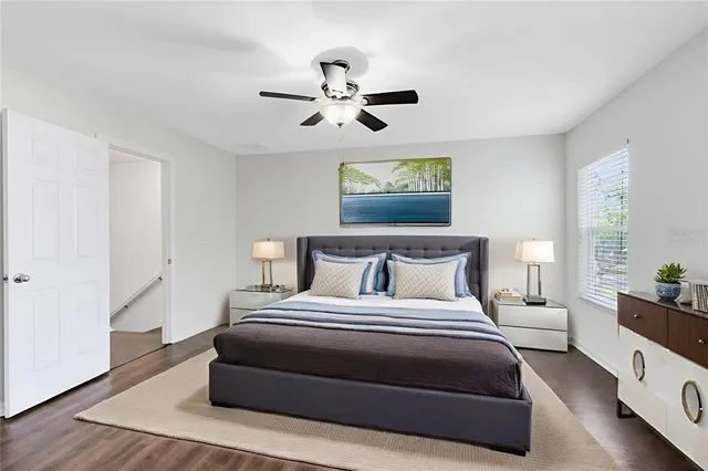 a bedroom with bed and window