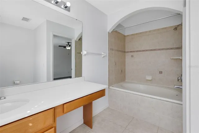 a bathroom with a bathtub and a sink