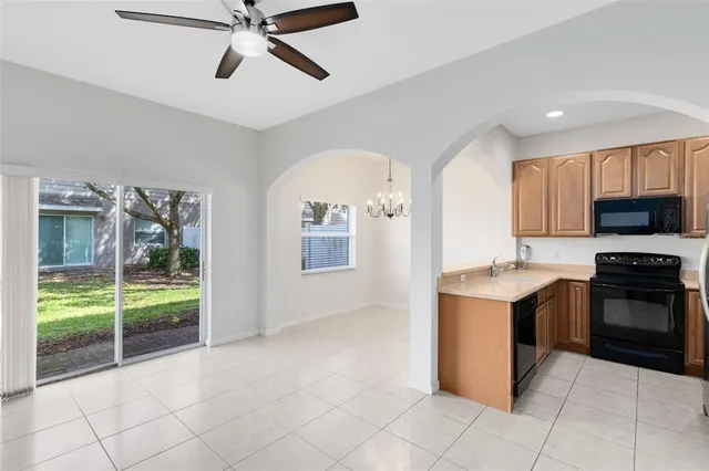 a kitchen with a stove a sink and a refrigerator