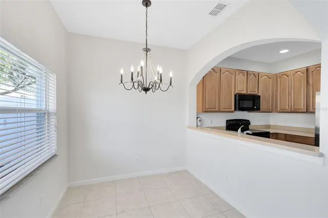 a view of a kitchen with a sink and dishwasher wooden floor
