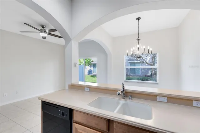 a kitchen with a sink and a window