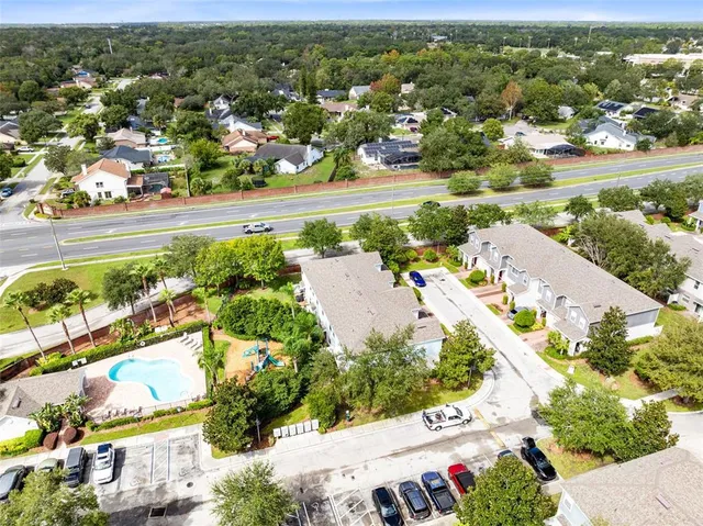 a view of a fountain in front of a house