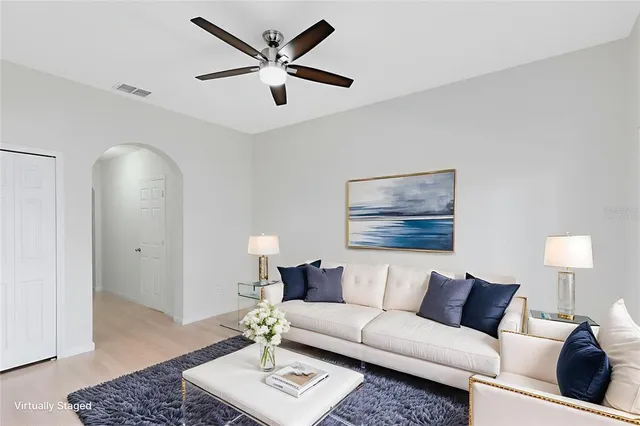 a living room with furniture and a rug