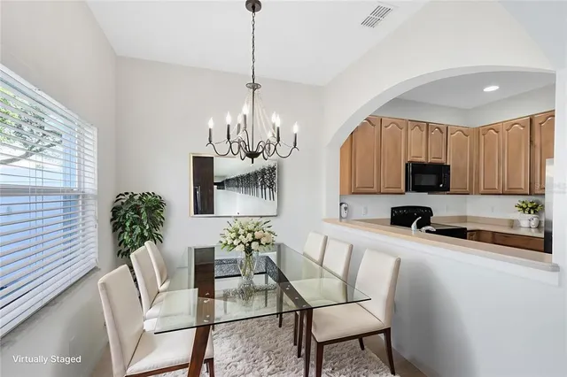 a view of a dining room with furniture window and outside view